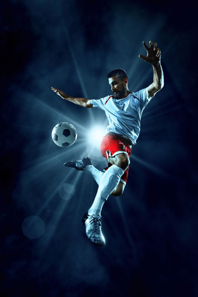 Фотообои Soccer player jump kick ball